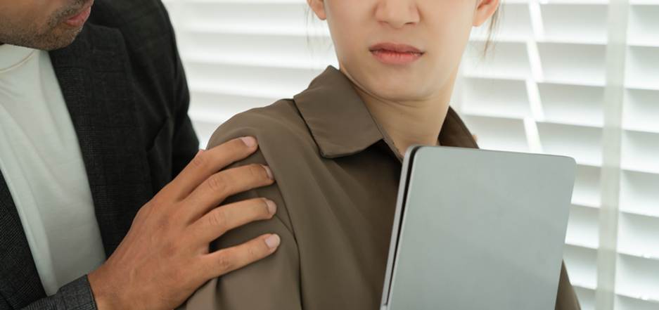 Woman uncomfortable with male coworker touching her - Sexual Discrimination